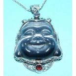 A Buddha head pendant, in silver, set wi