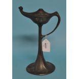 An Art Nouveau Kayserzinn pewter table oil lamp, with loop handle and raised foliate decoration,