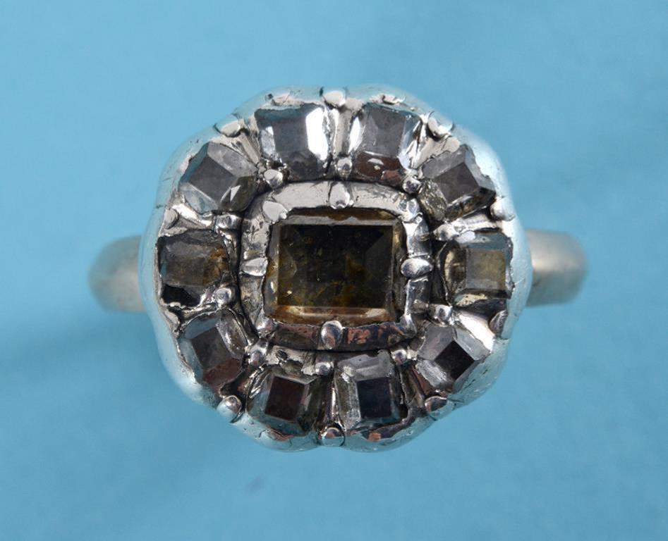 A table cut diamond cluster ring, in a y