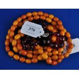 A string of amber style beads, with a te