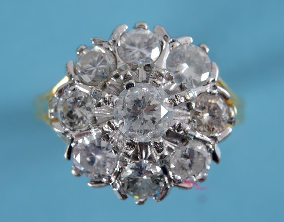 An 18ct gold and diamond flowerhead ring