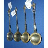 Four 17th century style white coloured metal spoons,