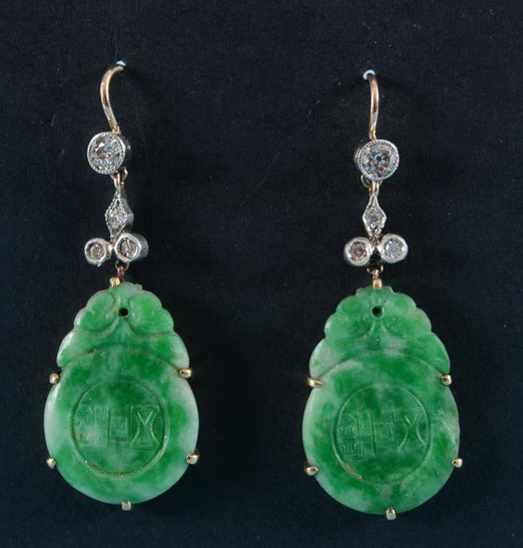 A pair of carved jade and diamond drop e