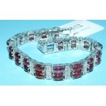 A silver and tourmaline line bracelet