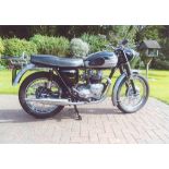 A 1960 Triumph Tiger T100A, registration number TAS 256, black and silver.