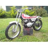 A 1974 Yamaha TY80 school boy trials, unregistered, white and red. The TY80 was a great success on