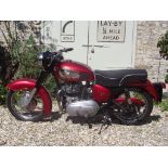 A 1960 Royal Enfield Meteor Minor, registration number 134 RPK, red.