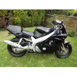 A 1994 Yamaha FZR 600R, registration number L565 XTL, black.