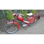 A 1957 Phillips Gadabout moped, registration number 971 UYJ, red.