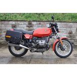 A 1984 BMW R45, registration number B74 OFX, red and black.