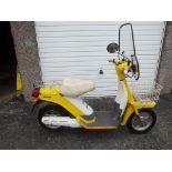 A 1980 Yamaha SA50 Passola scooter, registration number JWV 175W, yellow.