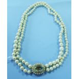 A two strand pearl necklace, with a larg