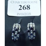 A pair of 18ct white gold, sapphire and