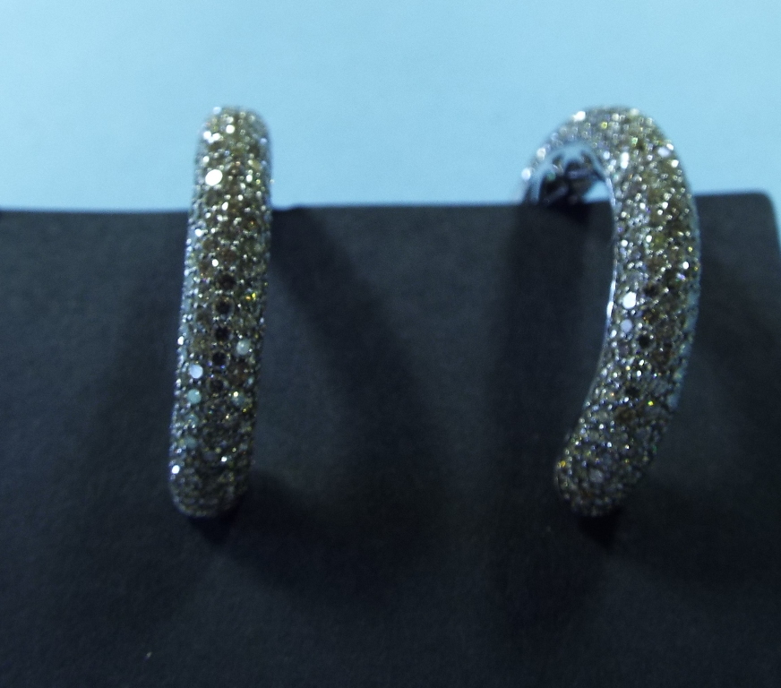 A pair of 18ct white gold and diamond ho