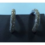 A pair of 18ct white gold and diamond ho