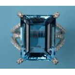 A large aquamarine and diamond ring, in