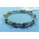 A 14ct gold, tanzanite and diamond brace