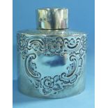 An oval silver tea caddy, initialled, an