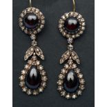 A pair of cabochon garnet and diamond dr