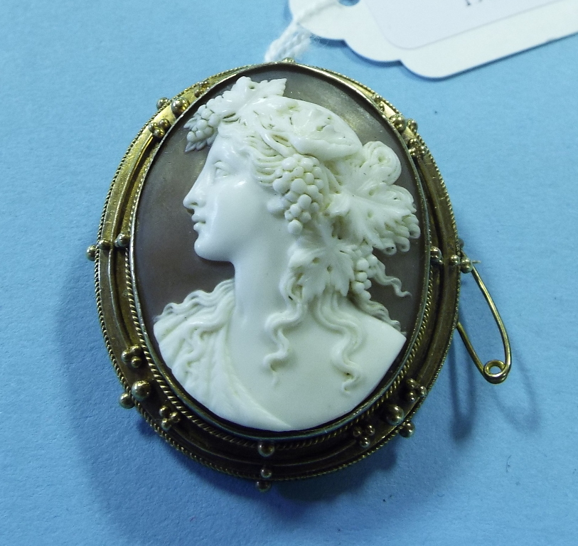 A cameo brooch, carved a portrait of a l