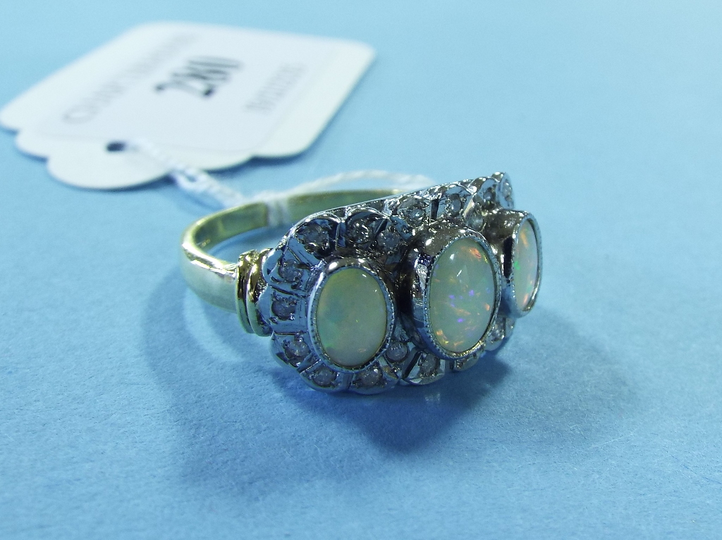 A 9ct gold, opal and diamond ring