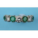 An 18ct white gold, emerald and diamond