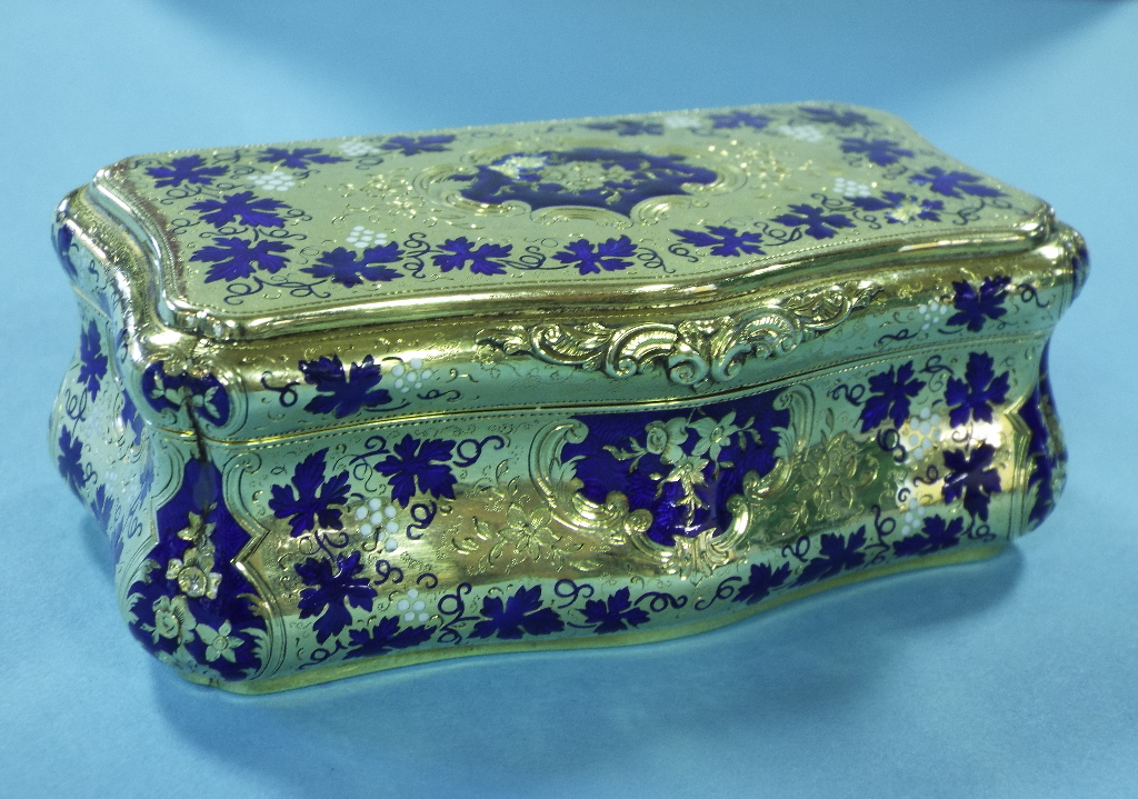 A gold and enamel box, of shaped rectang