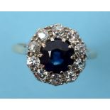 A sapphire and diamond cluster ring, in