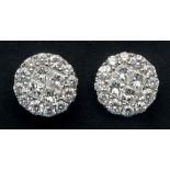 A pair of 18ct white gold and diamond st