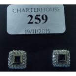 A pair of 14ct white gold, sapphire and