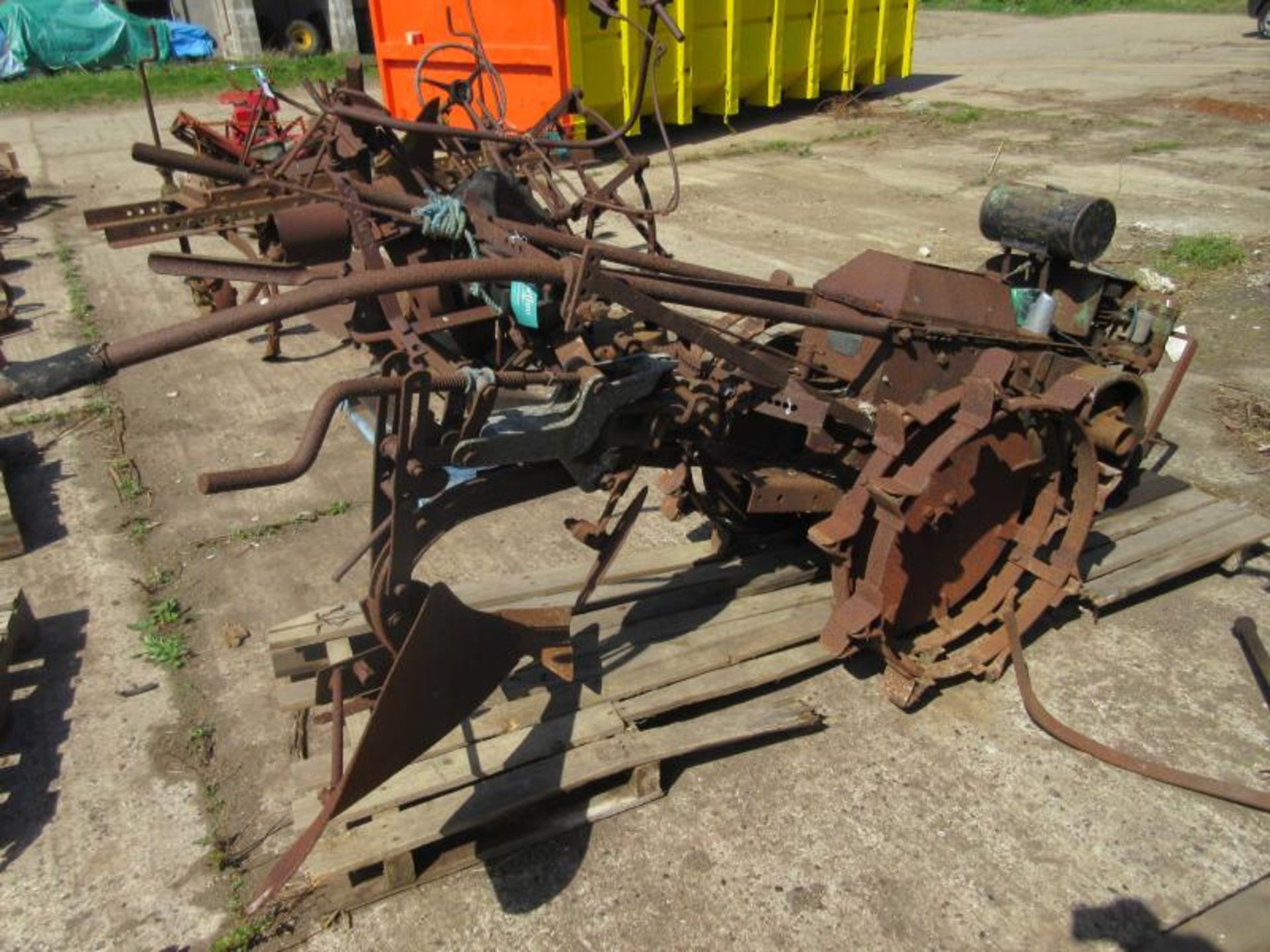 Trusty pedestrian tractor with single furrow plough attachment