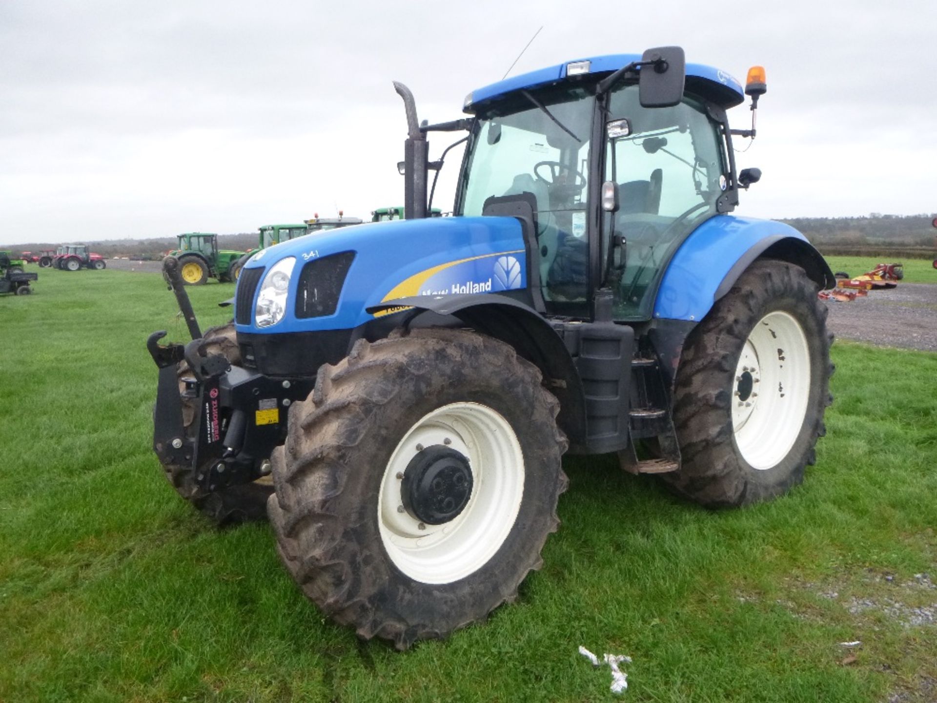 New Holland T6090 50k Power Command Tractor with Cab & Axle Suspension, Front Linkage.  3960 hrs.