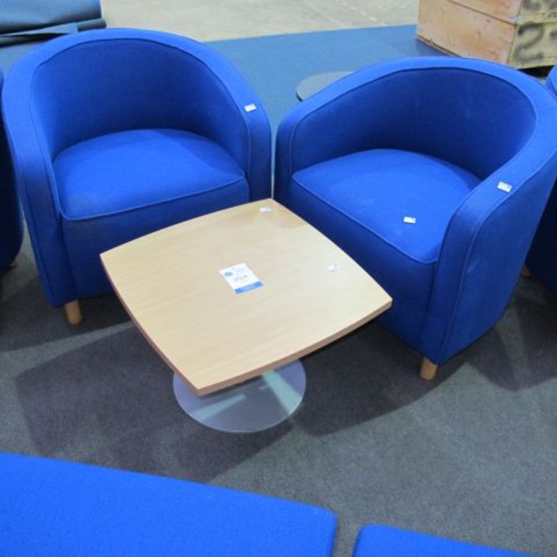 * A set of two blue Fabric Covered Reception 'Tub' Chairs with a Swivel Top Laminated Pine Table,