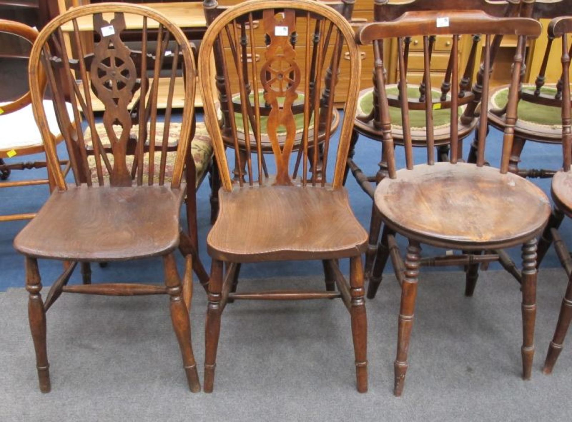 A Set of Four Spindle Back Circular Seat Dining Chairs Together With a Pair of Wheelback Single
