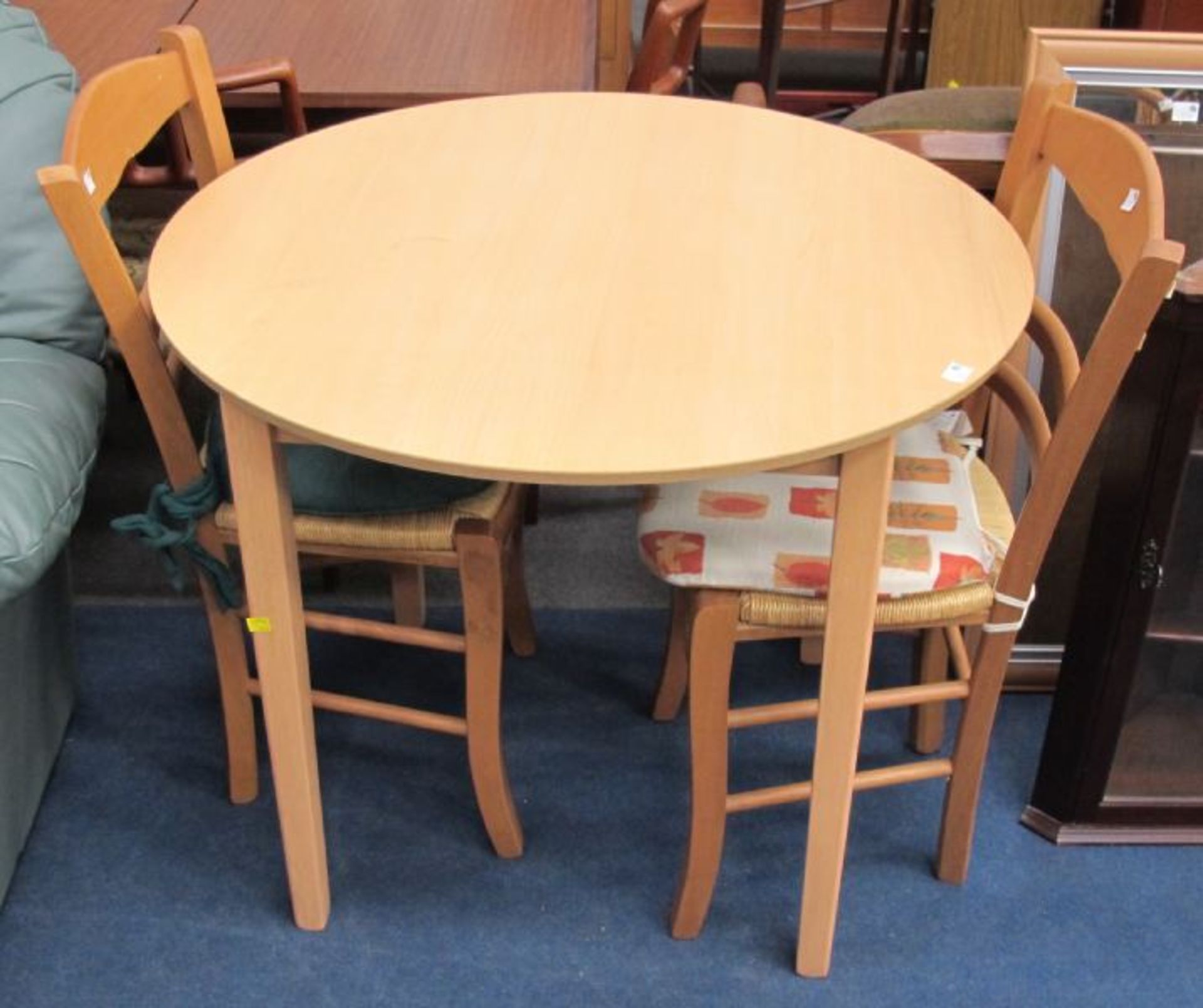 A Modern Light Wood Finish Circular Kitchen/Breakfast Table with Matching Single Chairs.  (est. £