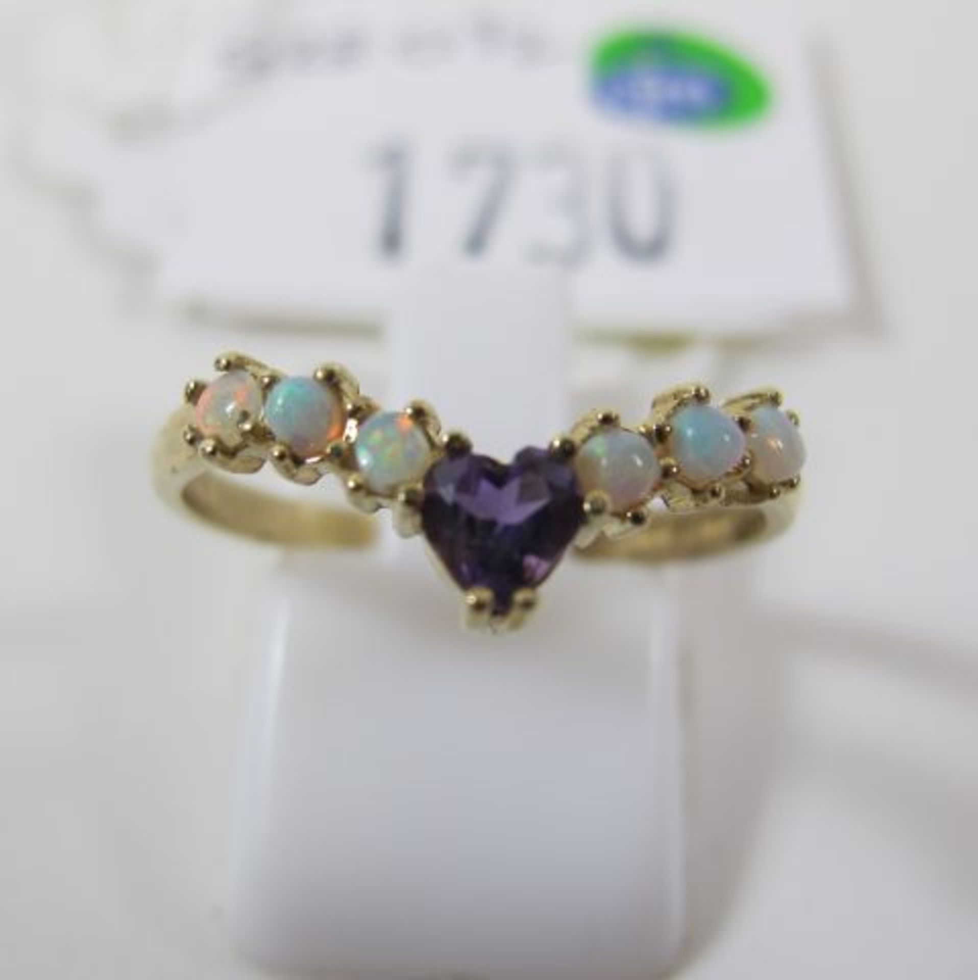 A 9ct Gold Opal and Amethyst Ring, size O½ (est. £35-£70)