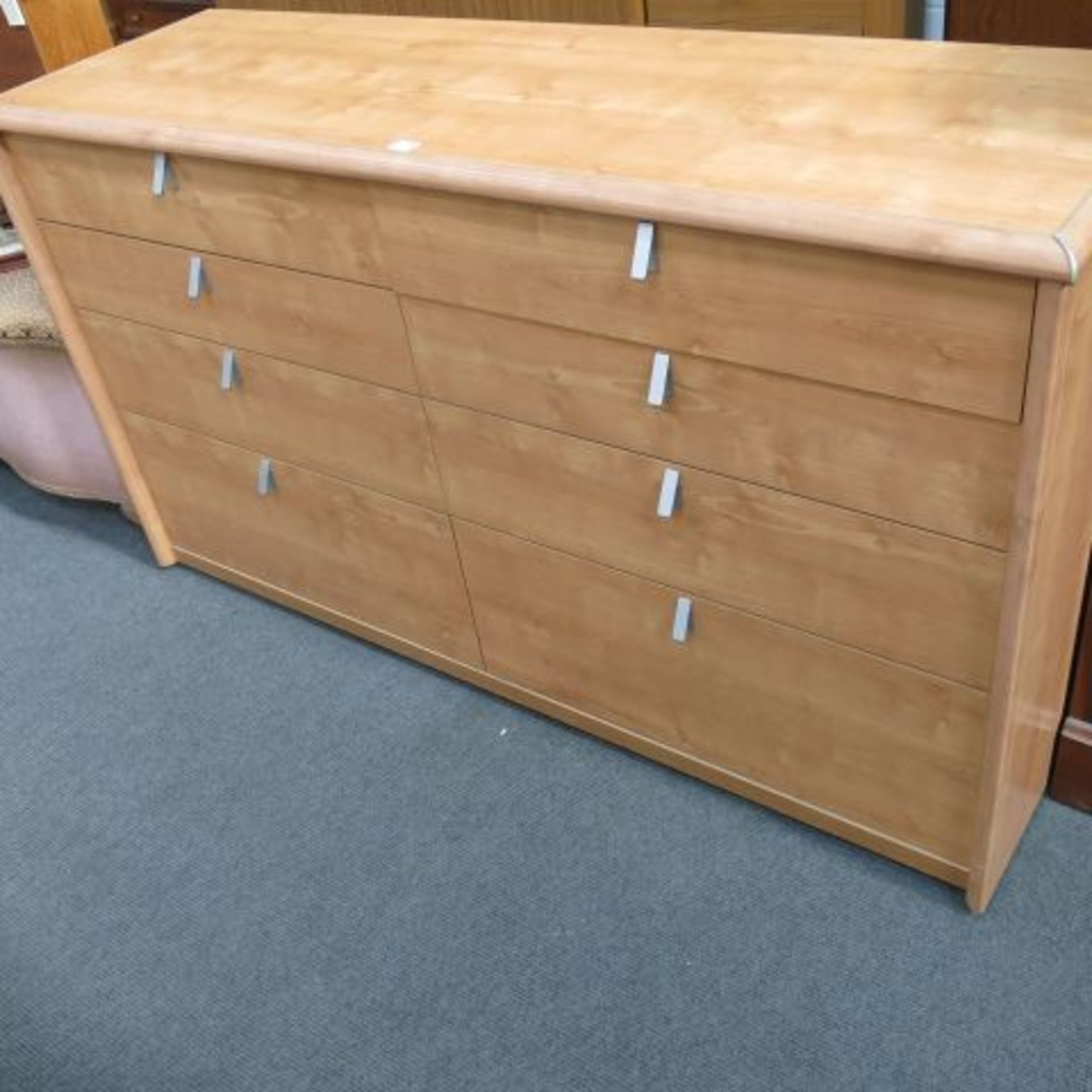 A Light Wood Finish Sideboard with Light Drawers.  145cms. (est. £30-£50)