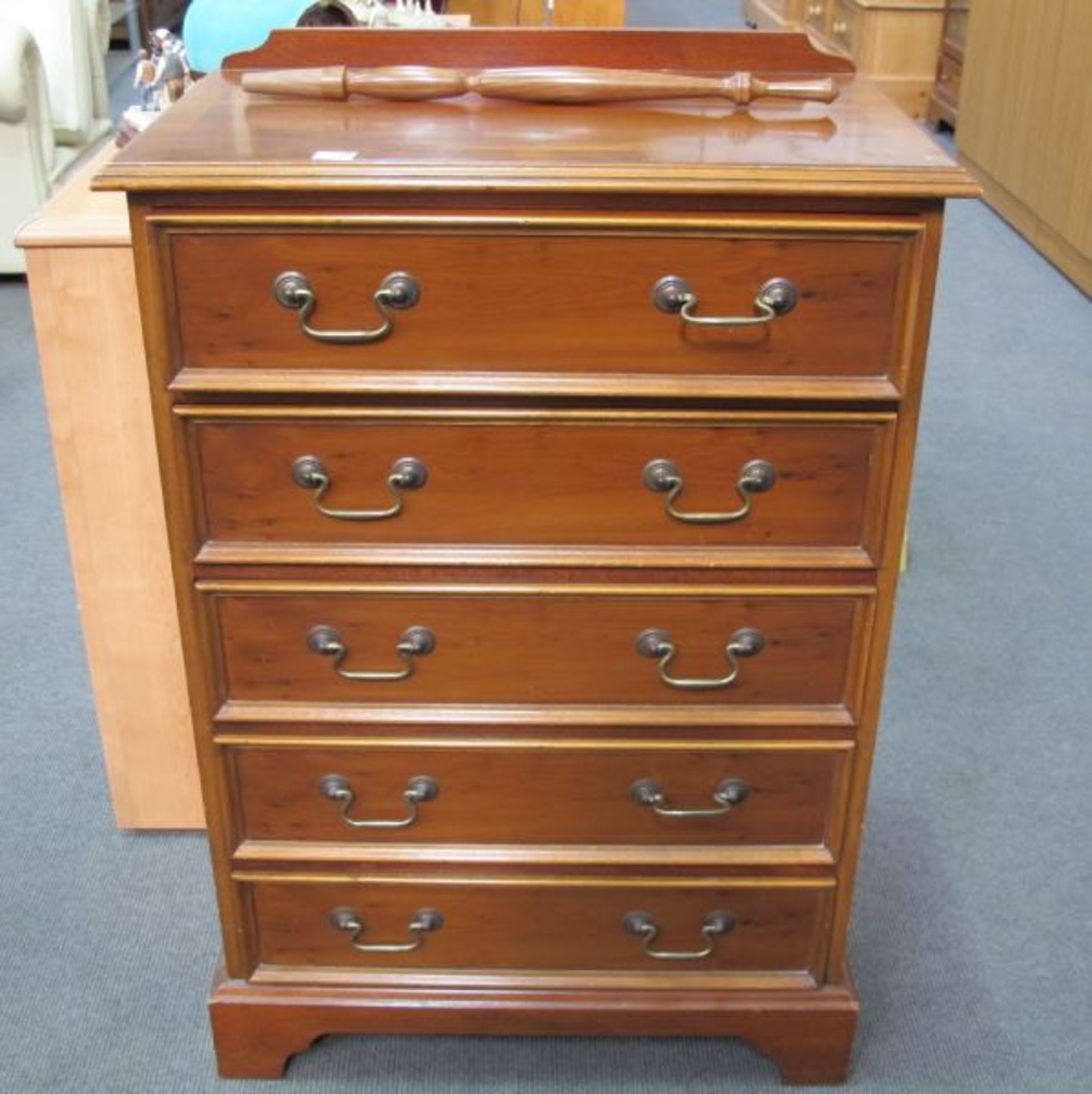 A Reproduction Yew Wood Five Drawer Chest.  67cms. (est. £40-£60)