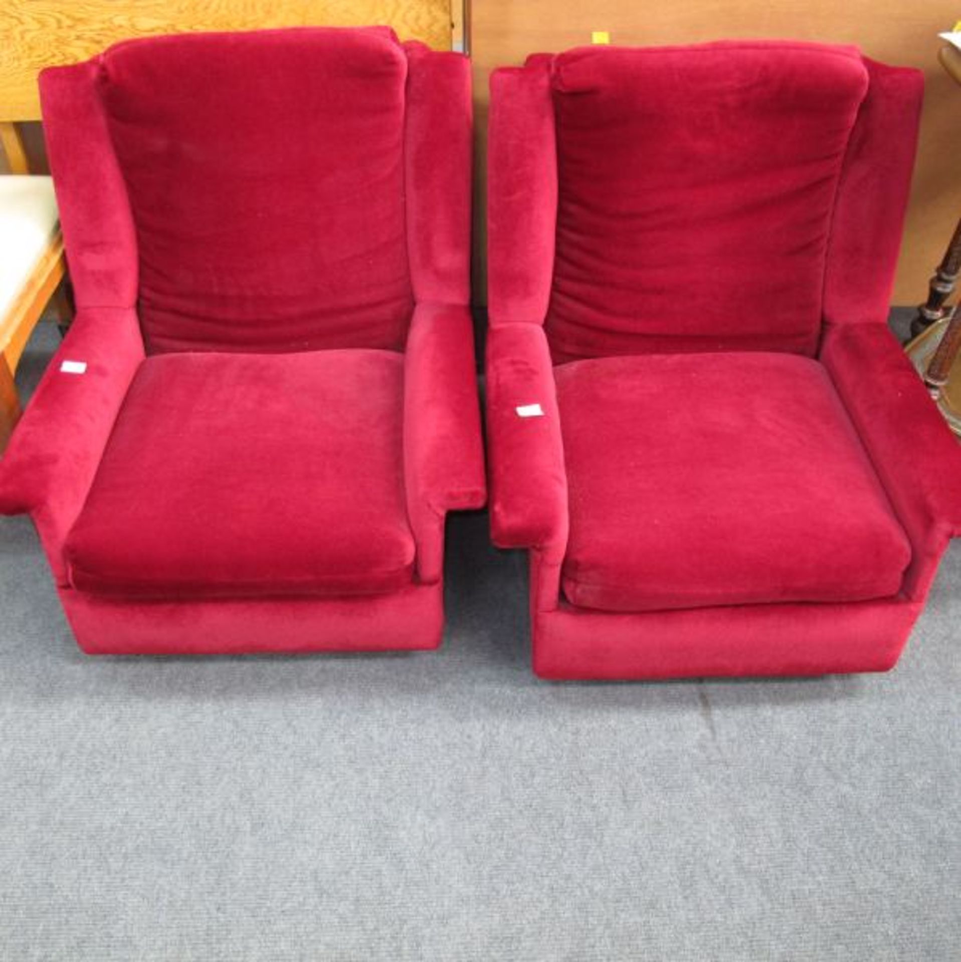 A Pair of Maroon Upholstered Low Armchairs (NB: These Do Not Conform to Current Upholstery