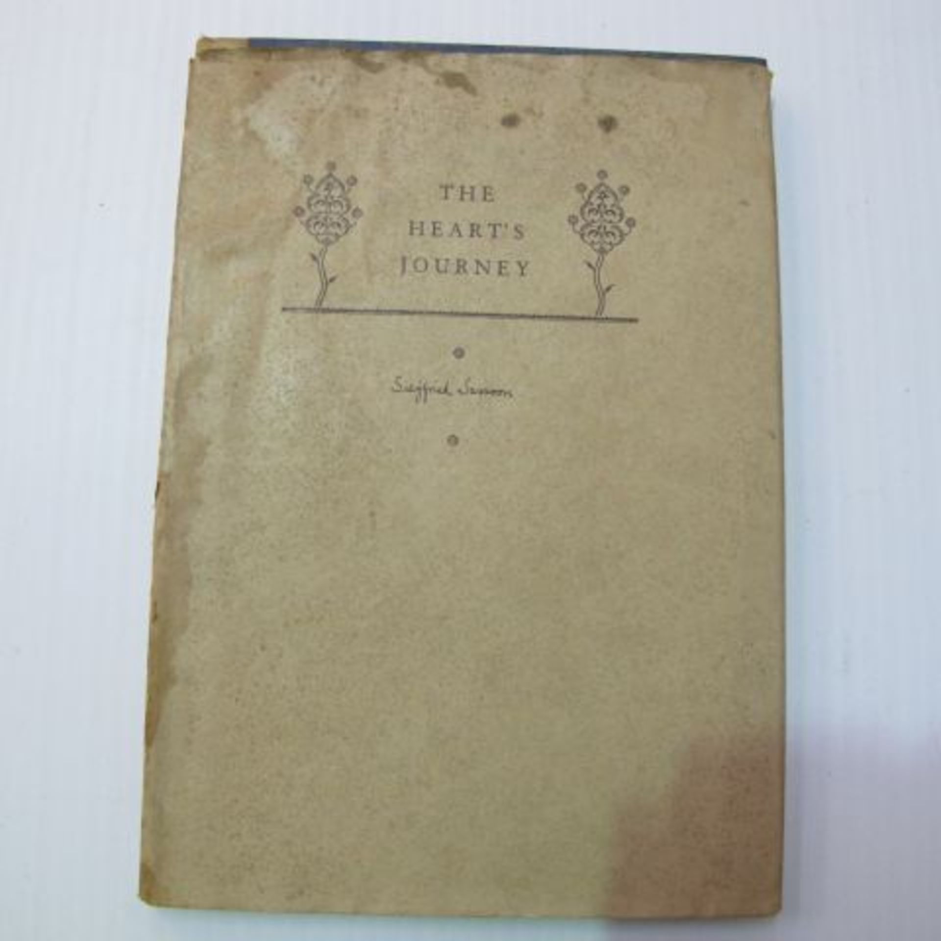 A hardback copy with dust cover of The Heart's Journey by Siegfried Sasson. The dust jacket