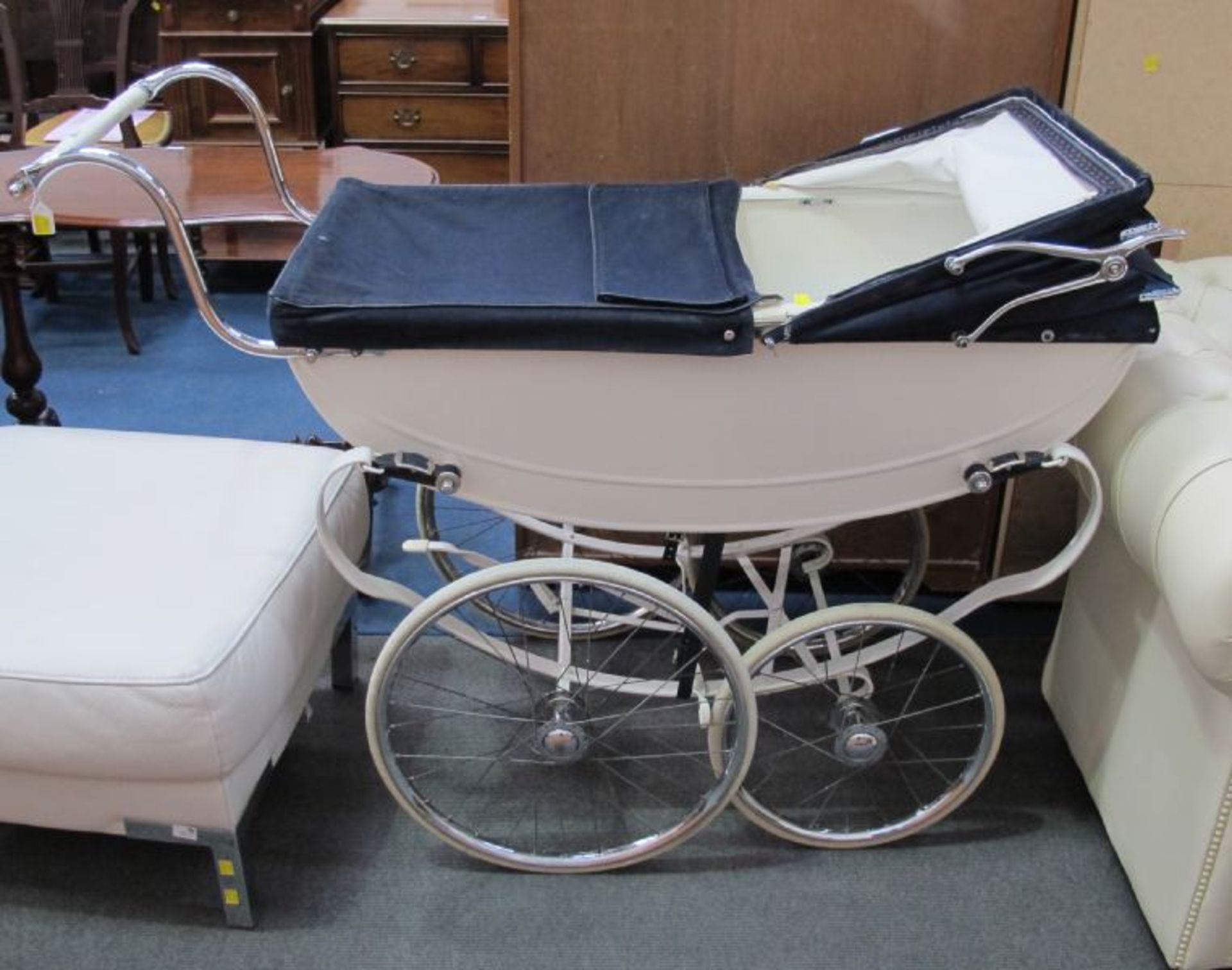 A Manton Metal Bodied Blue Canvas Top Perambulator.  (est. £20-£30)