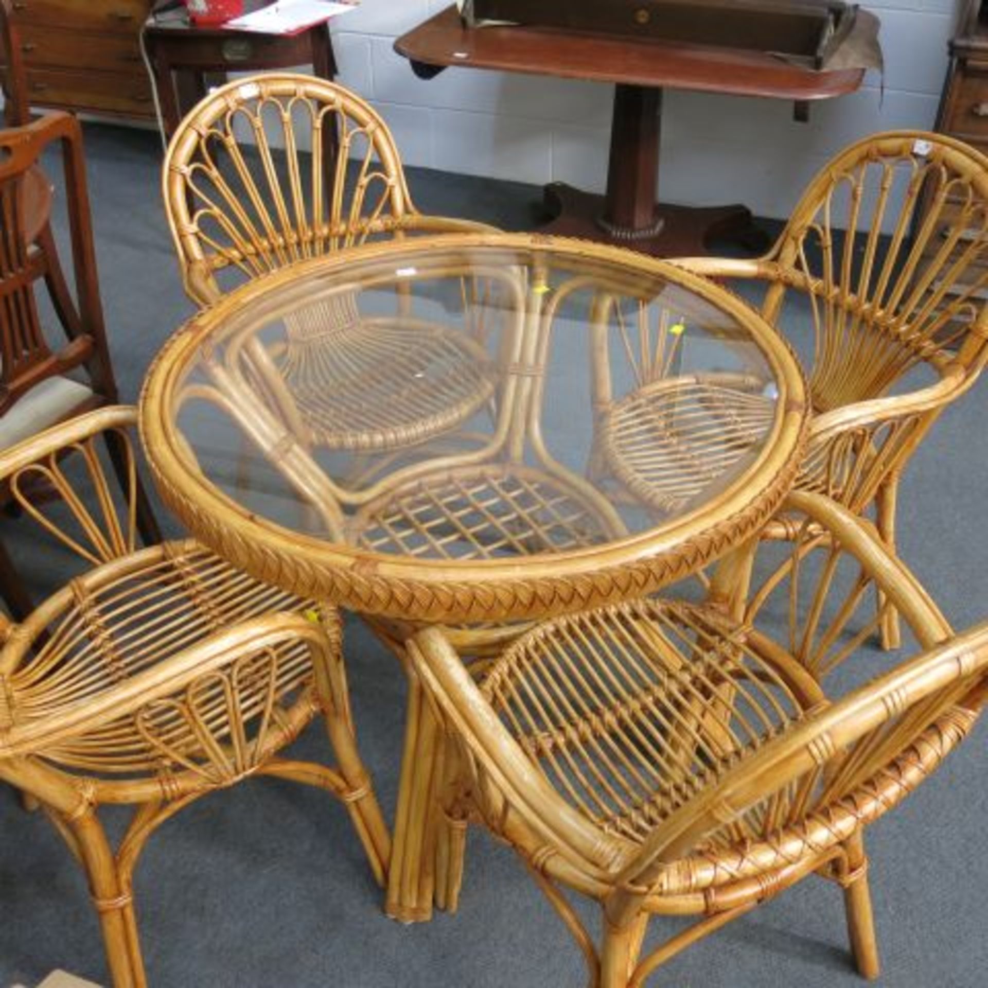 A Wicker Garden or Conservatory Dining Set - Glass Top Circular Table and Four Basket Chairs. (