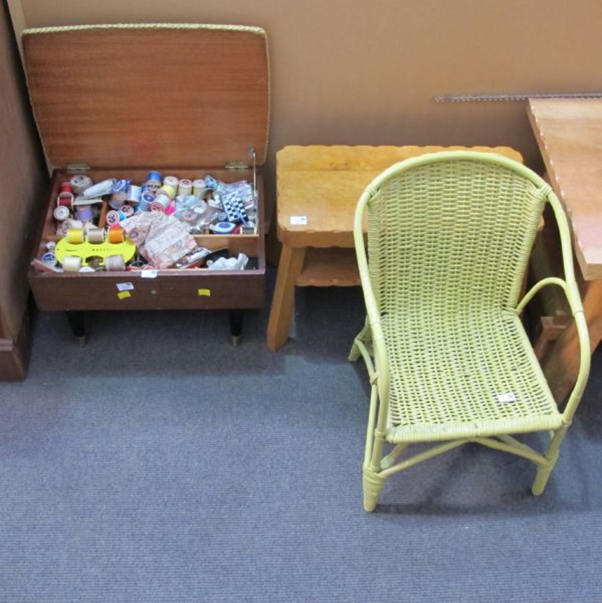 A Sewing Stool with Contents; Two Carved Low Coffee Tables; a Child's Wicker Chair and a Magazine