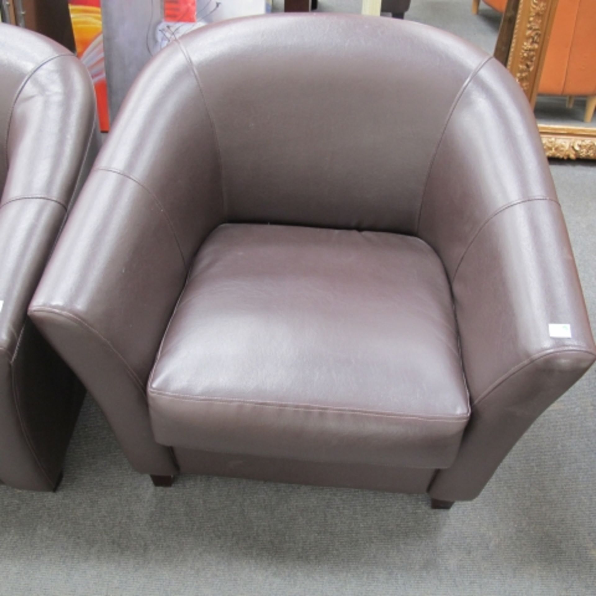 Set of four brown faux leather tub chairs (est. £50-£90)