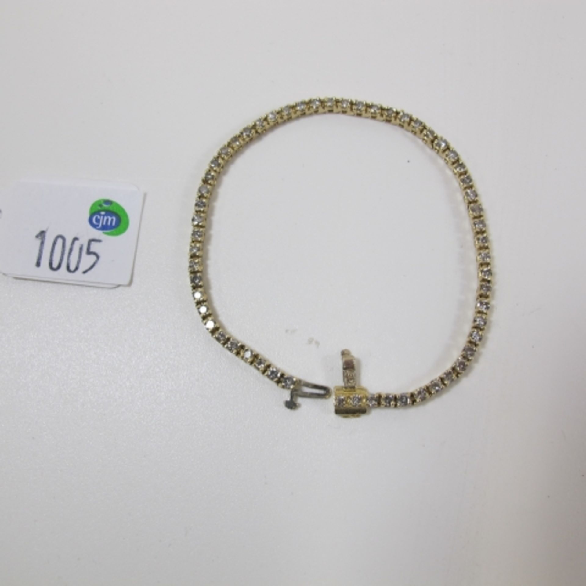 A 14K gold bracelet set with fifty eight diamonds (approximately three carats) (est. £350-£500)