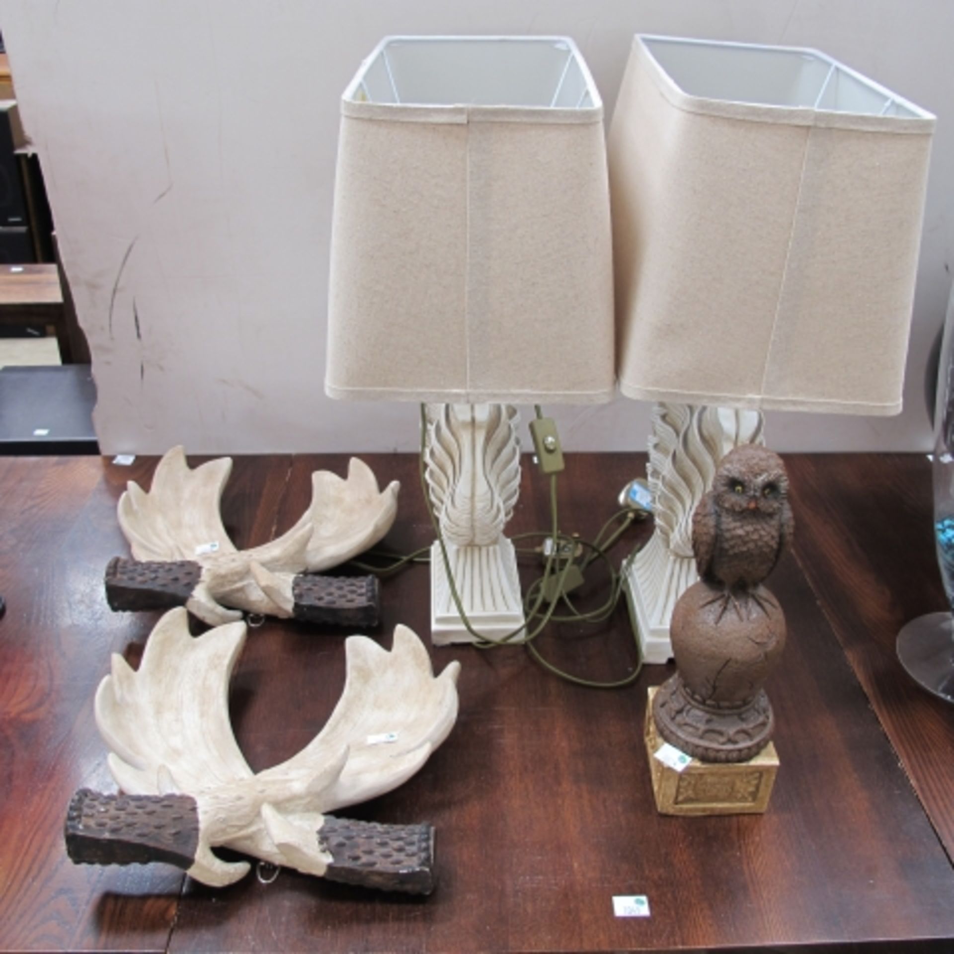 Pair of table lamps with moulded shell type bases, a pair of moulded antler type ornaments and a