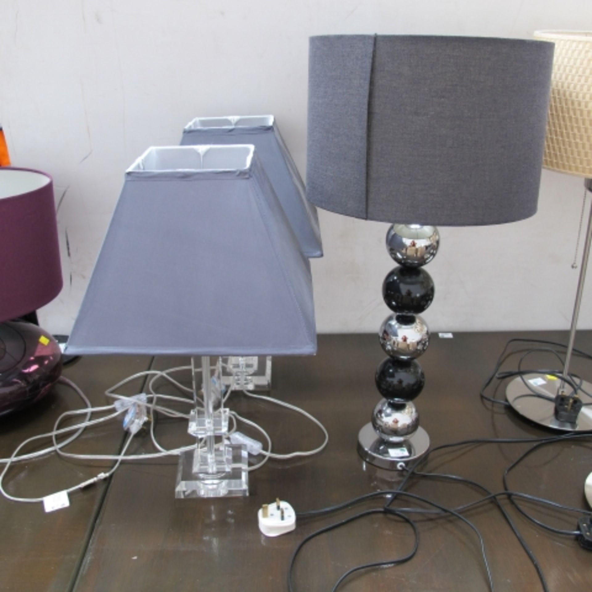 A pair of square crystal type table lamps and another with spherical type stem (3) (est. £20-£30)