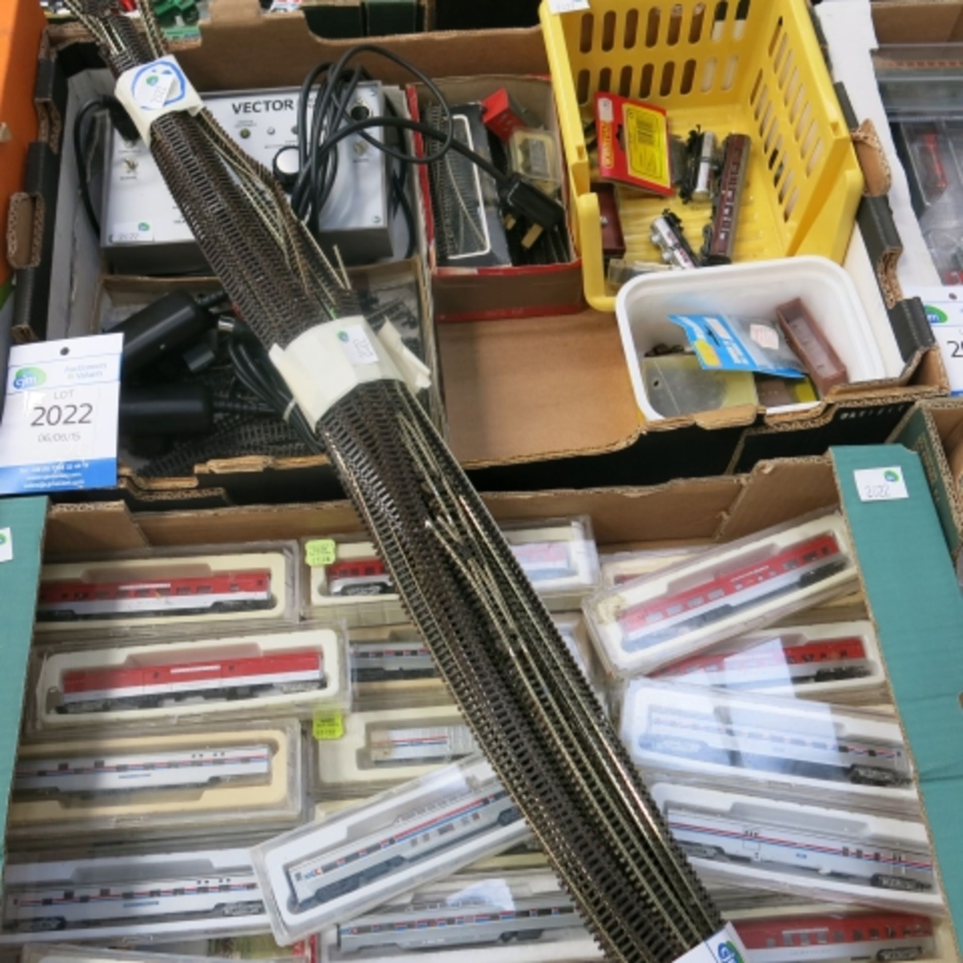 A box of approximately thirty 'N' gauge coaches and a box of miscellaneous 'N' track and rolling