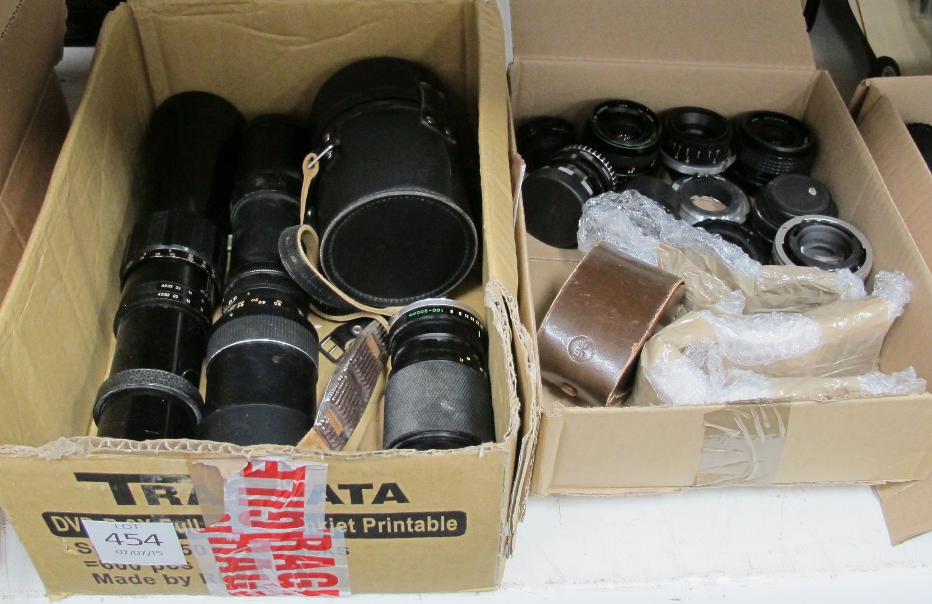 4 x Boxes of assorted camera lenses etc