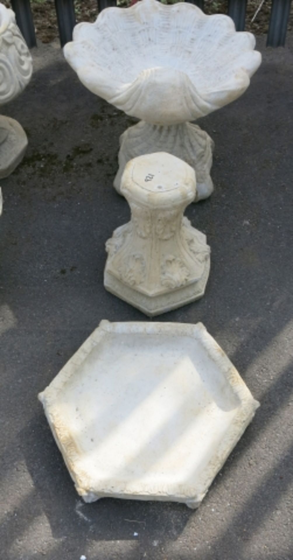 A shell bird bath and a classico bird bath